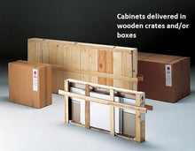 Four Premier Lite 12.120B Wood Display Counters packed for delivery: some with lockable drawers and veneered wooden bases. Two are in cardboard boxes, two in wooden crates. Text: Delivered in wooden crates and/or boxes.