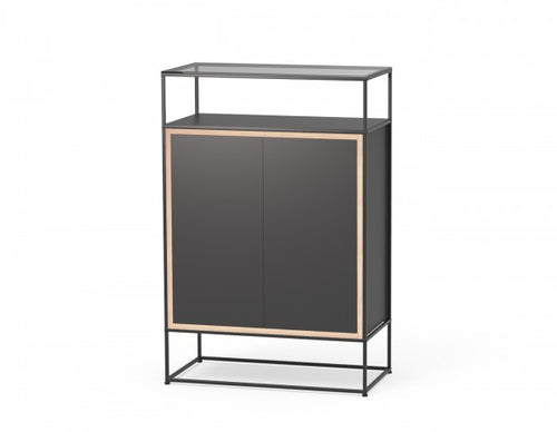 The Caroline Display Shelving Furniture With Glass Top MR-TG-CD14 features a modern black cabinet with two doors, light wood trim, an open base frame, and a top metal shelf with a glass surface for a minimalist, contemporary look.